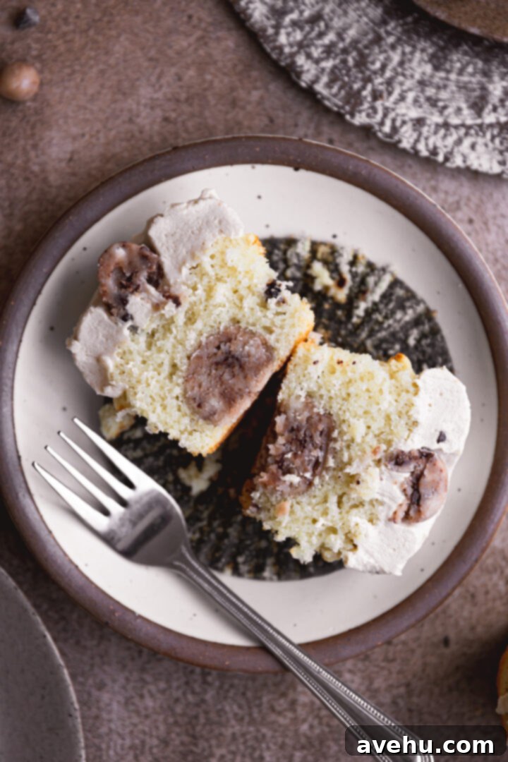 Easy Surprise Cookie Dough Cupcakes 2 A cookie dough cupcake cut in half to show the cookie dough inside.