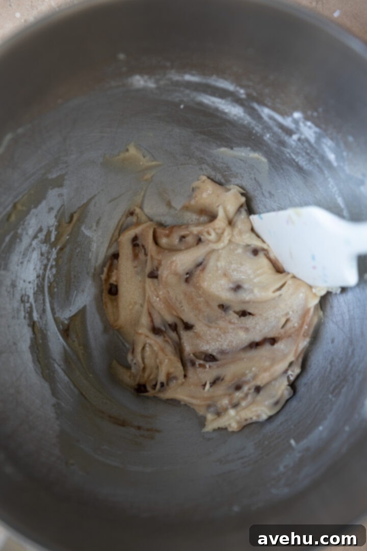 Easy Surprise Cookie Dough Cupcakes 5 Raw cookie dough mixed in a mixing bowl.