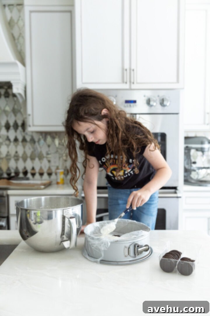 No-Bake 4-Ingredient Chocolate Dream 7 A young girl making an icebox cake.