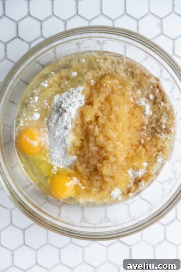 All ingredients for a pineapple cake in glass bowl.