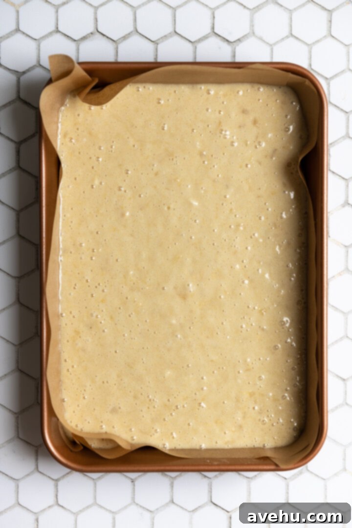 Batter for a pineapple cake in a 9x13" pan.