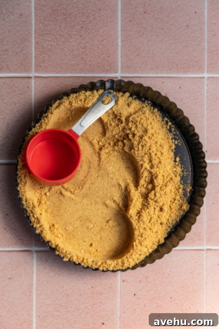 Foolproof S'mores Pie with Decadent Chocolate 4 Graham cracker crust pressed into a tart pan.