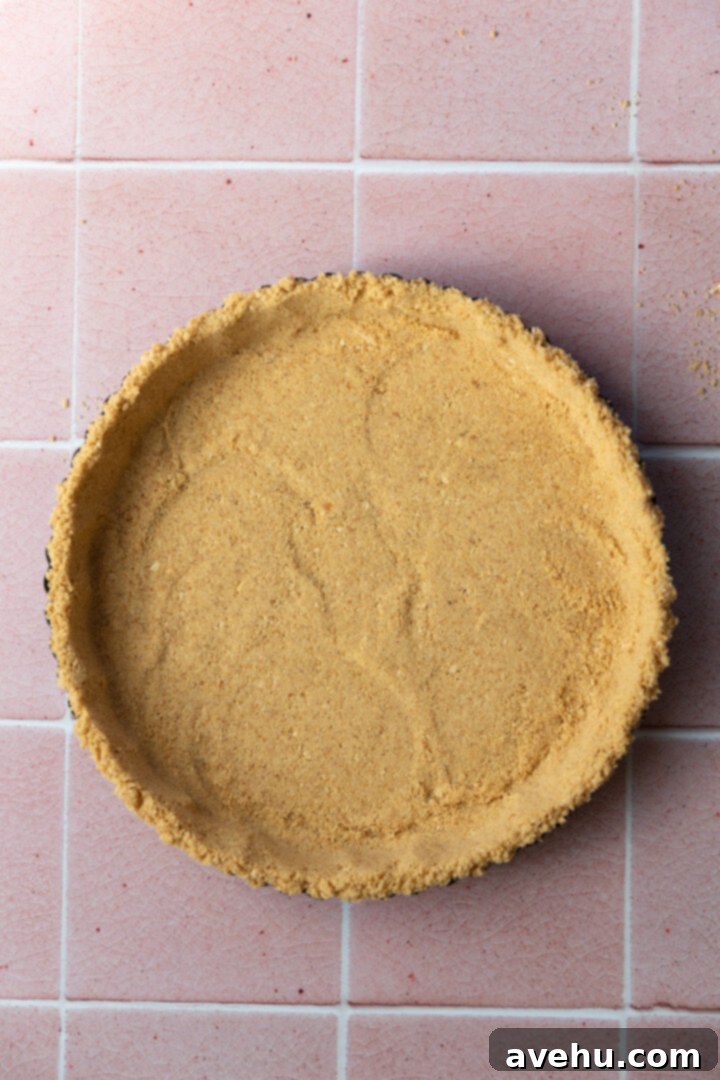 Foolproof S'mores Pie with Decadent Chocolate 5 A tart pan lined with graham cracker crust.