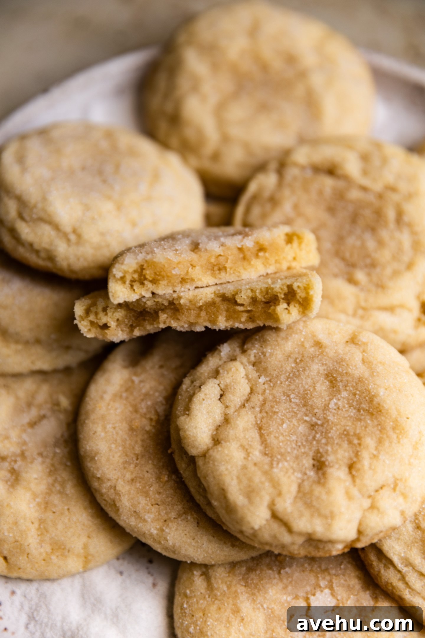 20-Minute Mixer-Free Sugar Cookies 10 A sugar cookie cut in half revealing its moist, soft, and incredibly chewy inside texture.