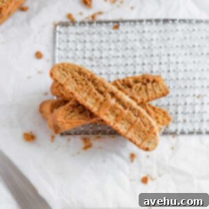 Speculoos Biscotti Perfection 2 cookie butter biscotti layered on top of each other on a white background.