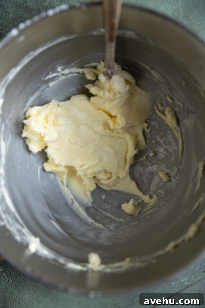 Effortless 3-Ingredient Snowball Cookies 5 Butter and powdered sugar creamed in a mixing bowl.
