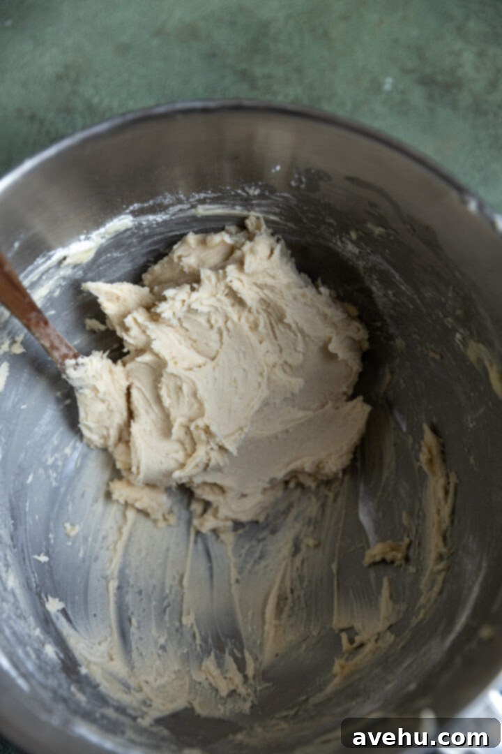Effortless 3-Ingredient Snowball Cookies 6 Snowball cookie dough in a mixing bowl.