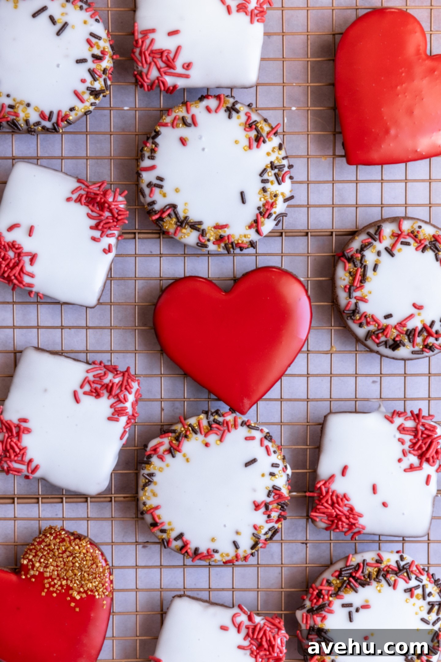 Quick No-Piping Cookie Icing 2 Cut out sugar cookies that are decorated with icing and sprinkles laying on a wire rack.