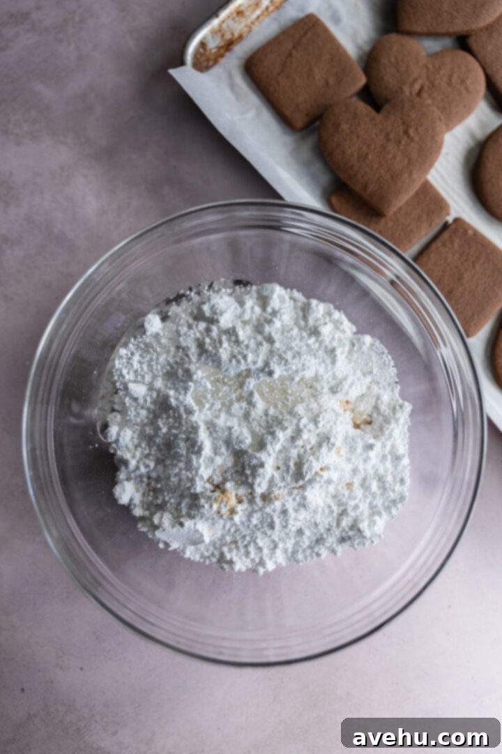 Quick No-Piping Cookie Icing 3 Ingredients for cookie icing in a glass bowl.