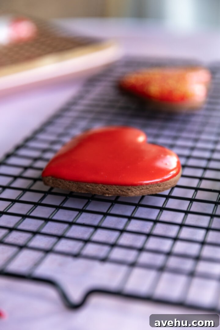 Quick No-Piping Cookie Icing 9 A heart shape cookie on a wire rack.