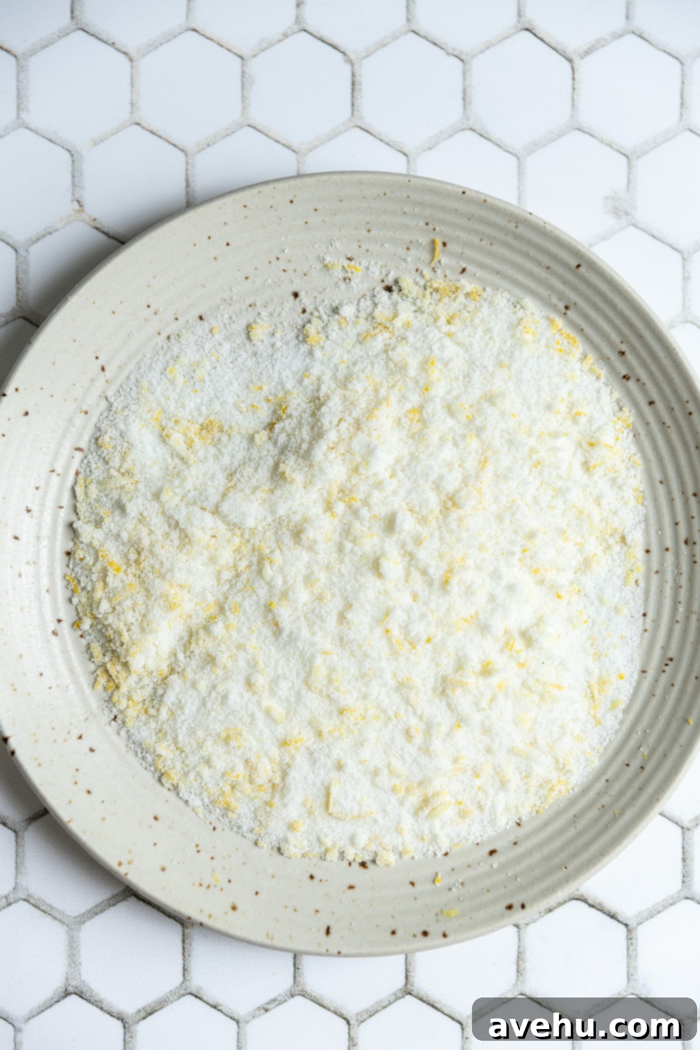 Zesty No-Chill Lemon Sugar Cookies 3 A bowl with lemon and sugar mixed together.