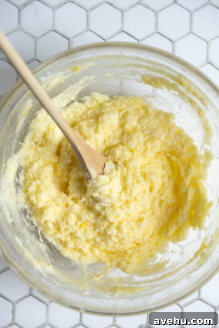 Zesty No-Chill Lemon Sugar Cookies 5 Wet ingredients for sugar cookies in a glass bowl.