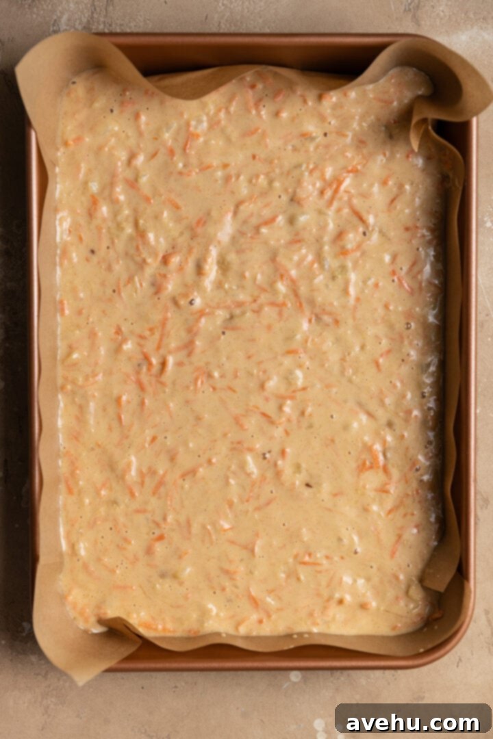 Sunshine Carrot Pineapple Sheet Cake 6 Batter for a carrot pineapple cake in a 9x13 pan.