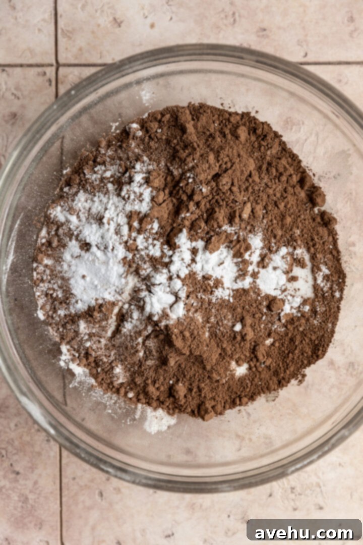 Ultimate Bakery Triple Chocolate Muffins 3 Dry ingredients for chocolate muffins in a bowl.