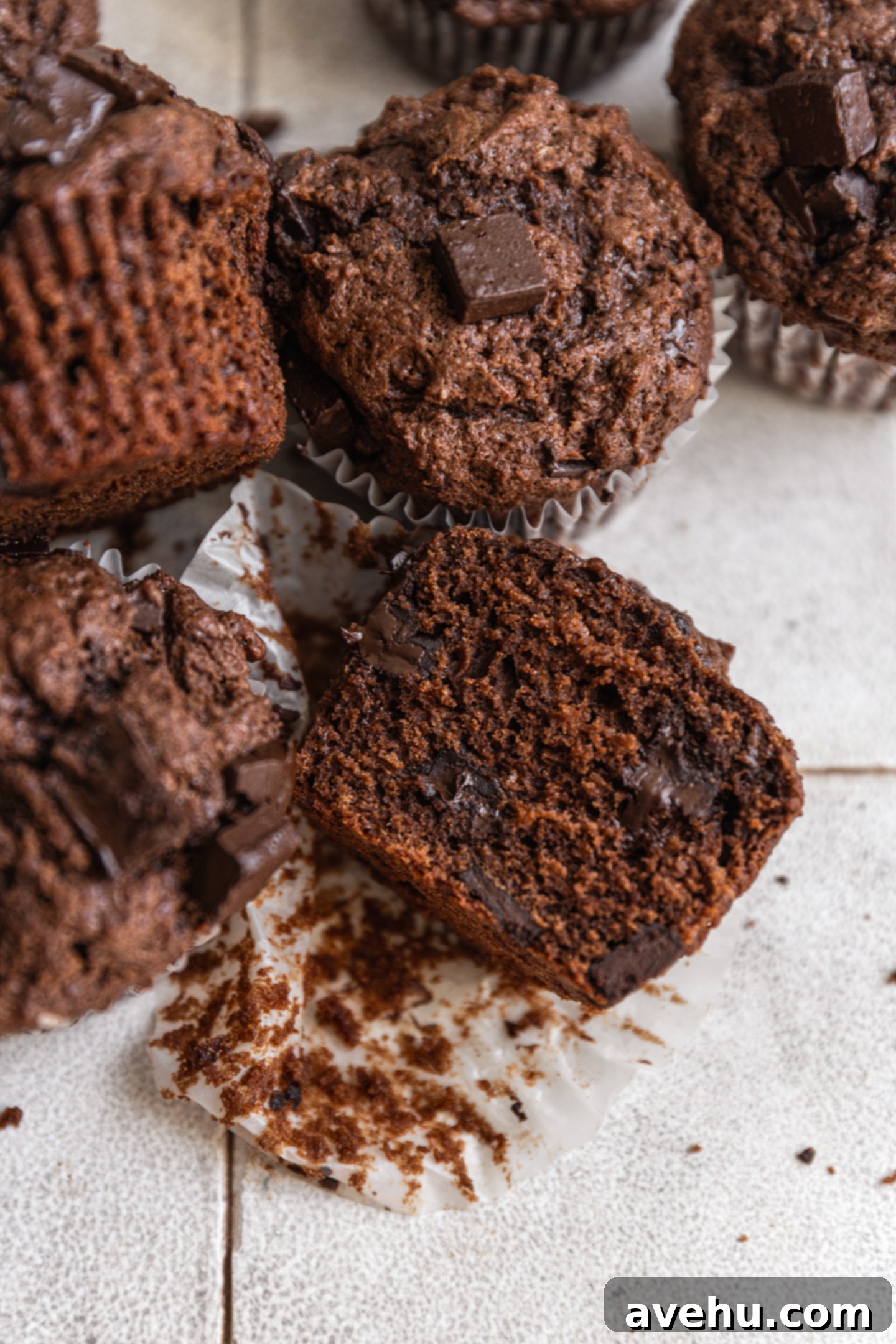 Ultimate Bakery Triple Chocolate Muffins 10 A chocolate muffin cut in half.