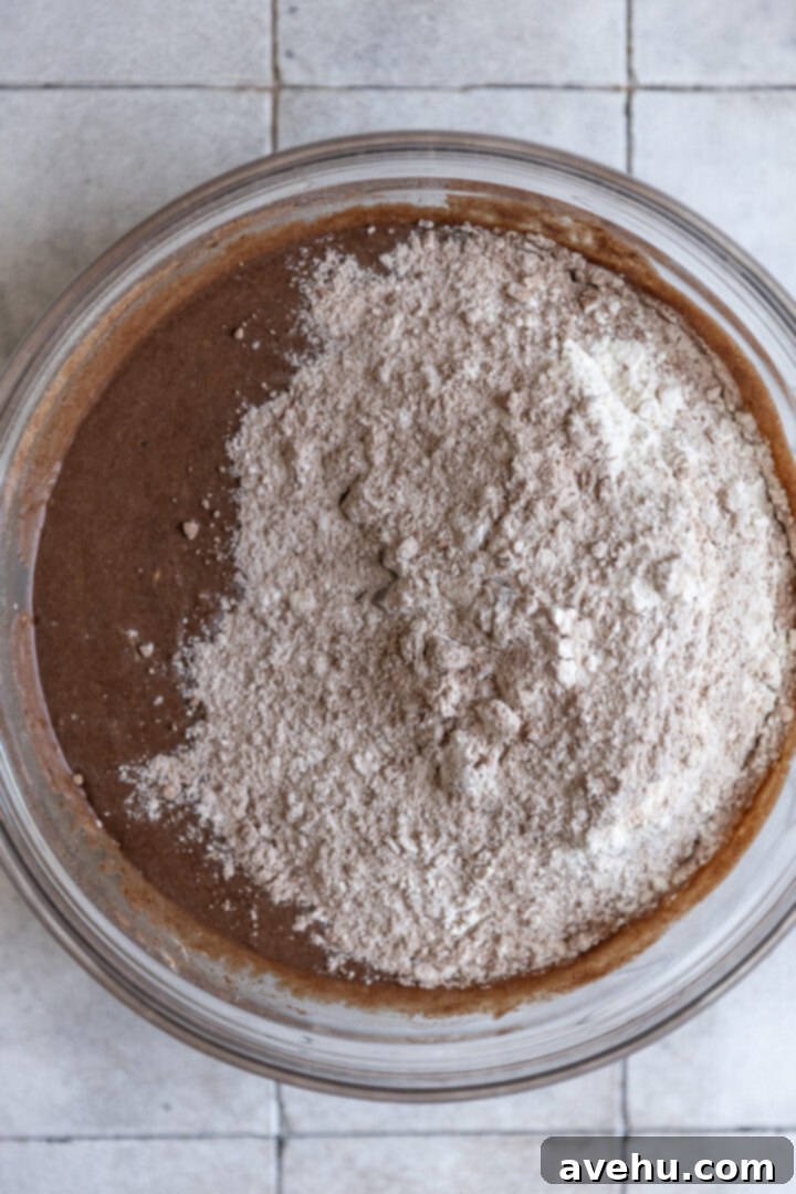 Melt-in-Your-Mouth S'mores Chocolate Muffins 6 Combined wet and dry ingredients for S'mores muffins in a mixing bowl, just before folding.