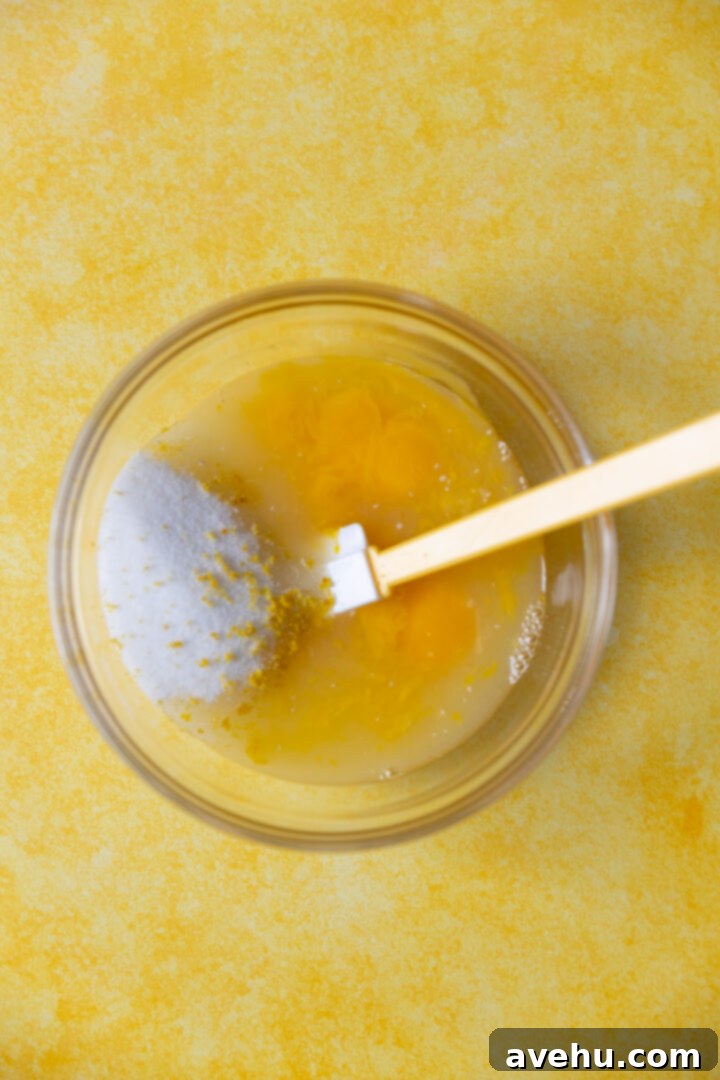 Zesty Lemon Curd Delight 3 Ingredients for lemon curd in a bowl.