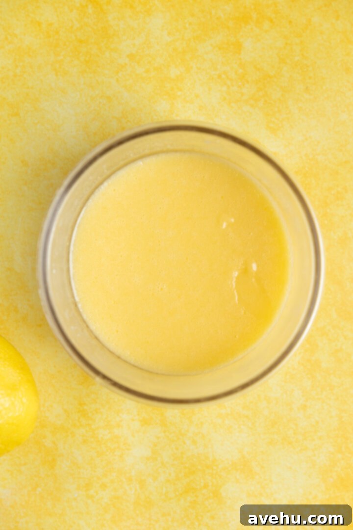 Zesty Lemon Curd Delight 6 Lemon curd in a glass bowl.