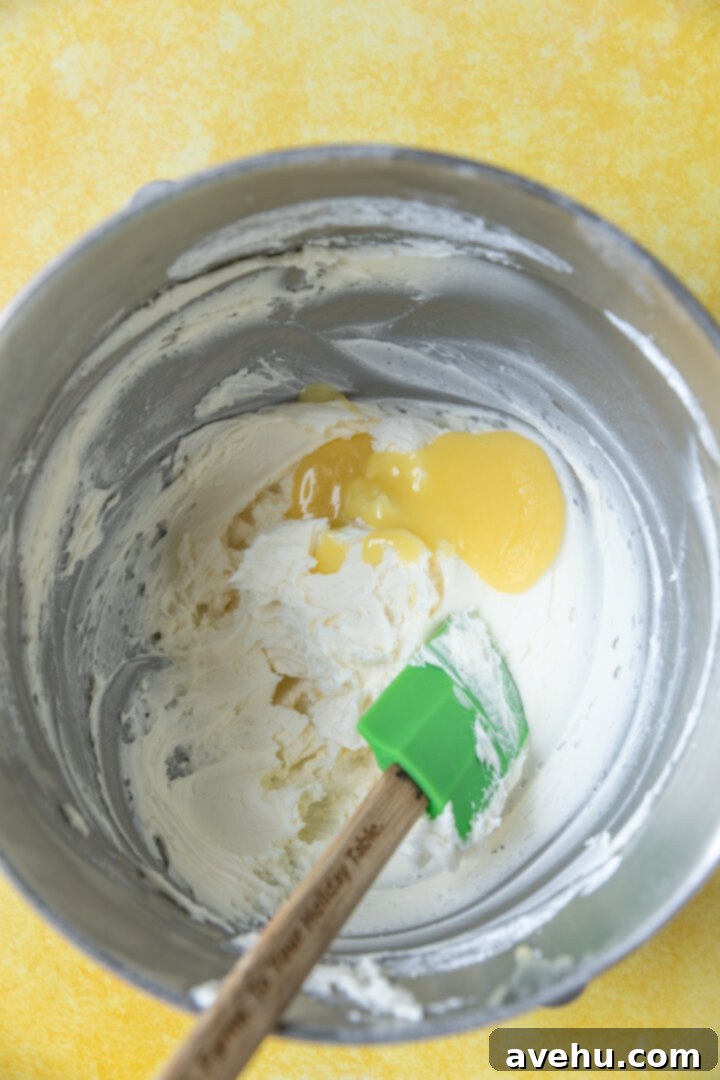 Zesty Lemon Curd Delight 9 Lemon curd added to frosting ingredients.