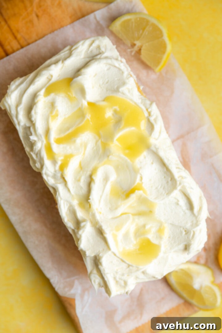 Zesty Lemon Curd Delight 10 A loaf cake topped with lemon curd frosting.