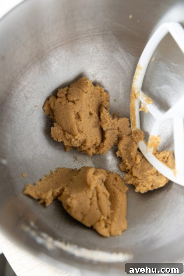 Maple-Glazed Autumn Apple Bites 3 Sugar and butter creamed in a mixing bowl.