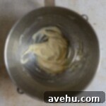 Zesty Orange Dark Chocolate Shortbread 3 Creamed mixtured of butter, sugar, and orange zest in a bowl.