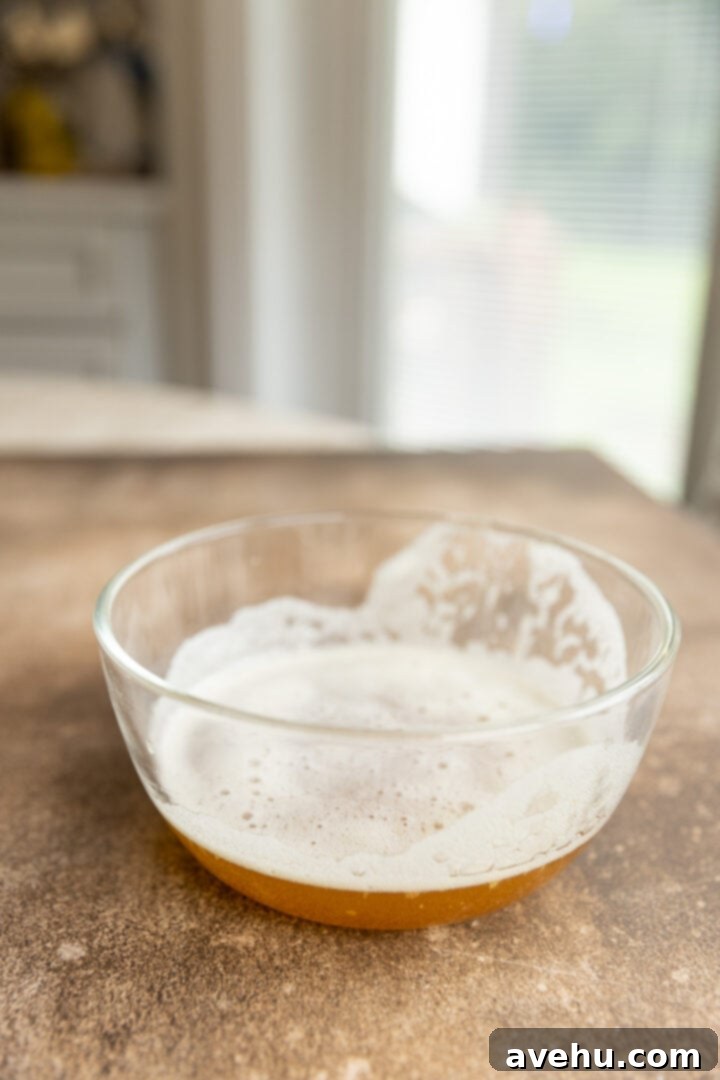 Your Ultimate Brown Butter Frosting 7 Brown butter with its flavorful flecks poured into a glass bowl, ready for chilling.