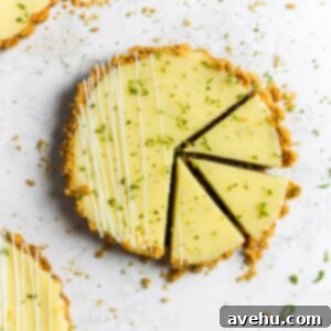 Foolproof Key Lime Pie 7 A delicious mini Key Lime Pie, sliced to reveal its creamy filling and golden graham cracker crust.