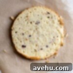 Effortless and Perfectly Moist Blackberry Cake 13 A yellow cake on brown parchment paper