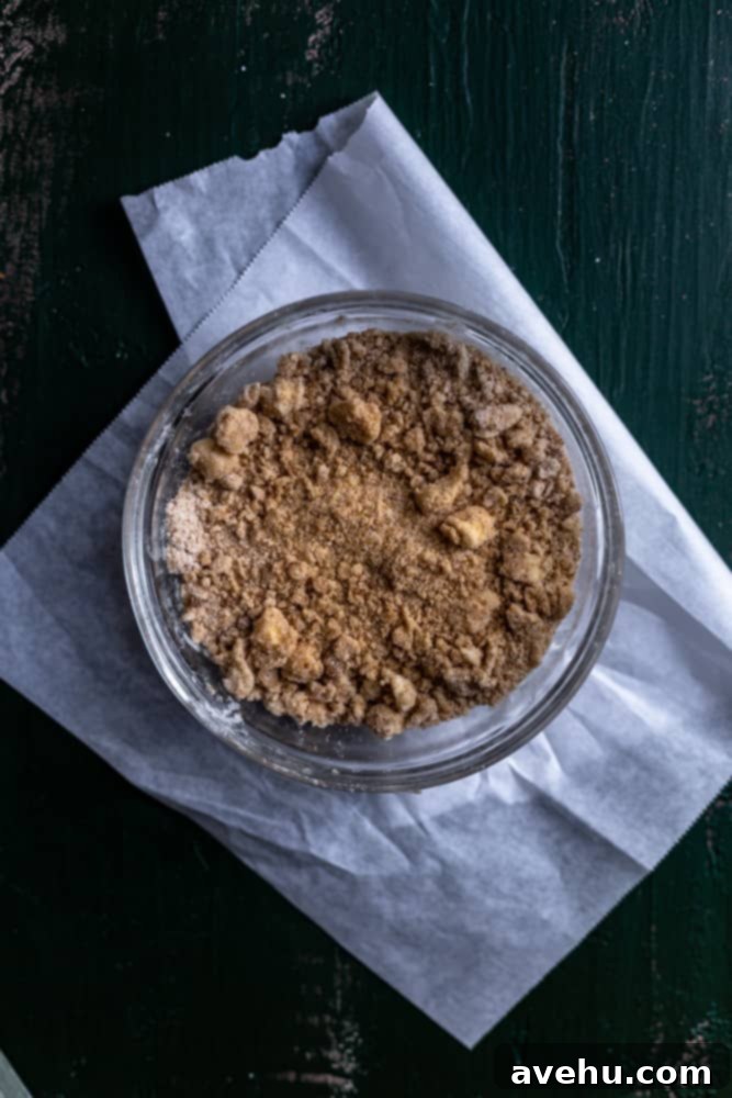 Generous 9x13 Apple Pie Bars 6 Crumb topping mixture in a glass bowl