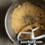 Chocolate Banana Velvet Dream 5 A creamy mixture of mashed banana, softened butter, brown sugar, and white sugar in a mixing bowl.