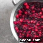Cooked cranberries in a pot.