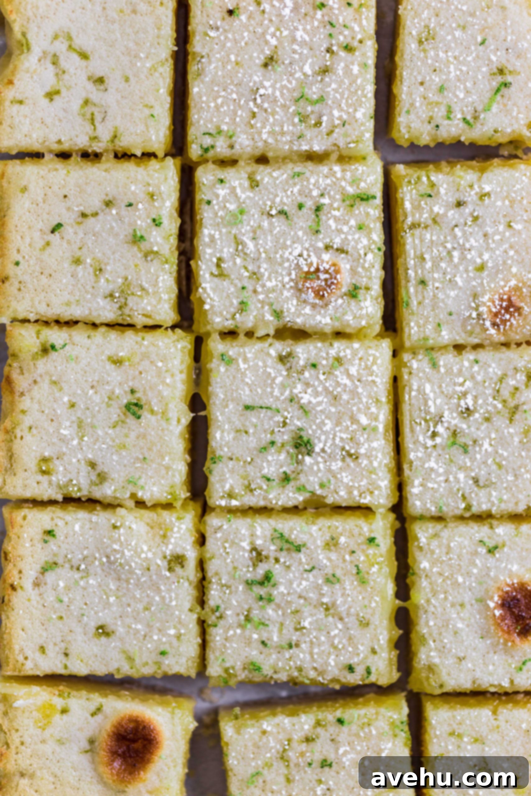 Triple Threat Lemon Bars 4 small cut squares of lemon bars topped with lime zest