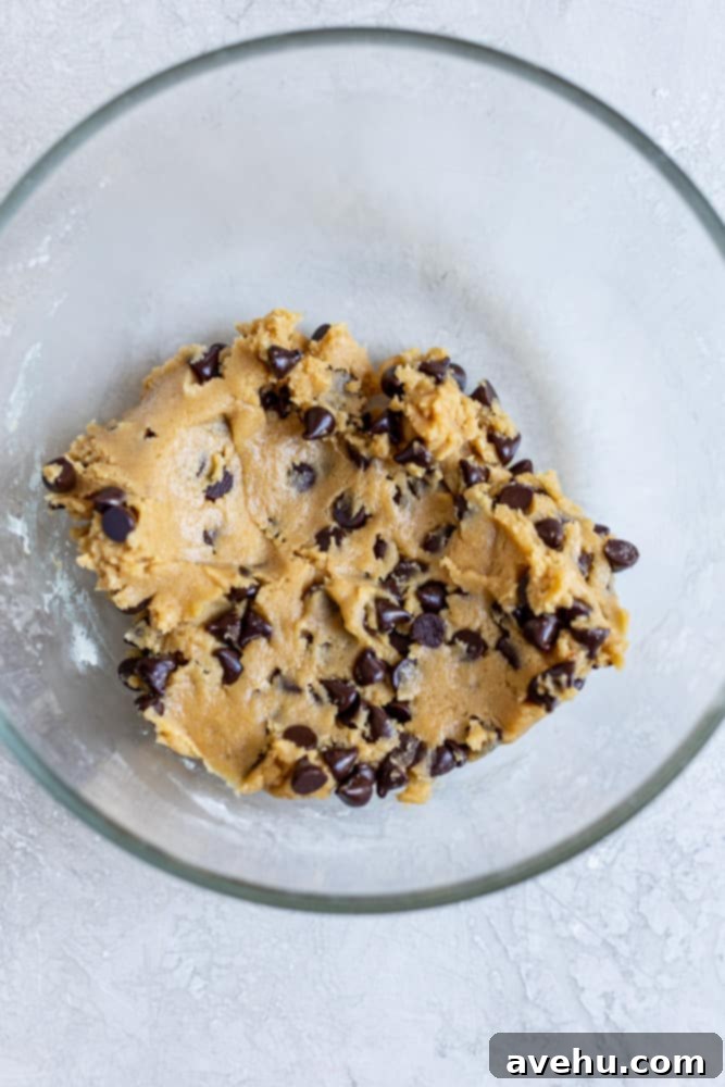 Speedy Six Chocolate Chip Cookies 4 Cookie dough with chocolate chips in a glass bowl.