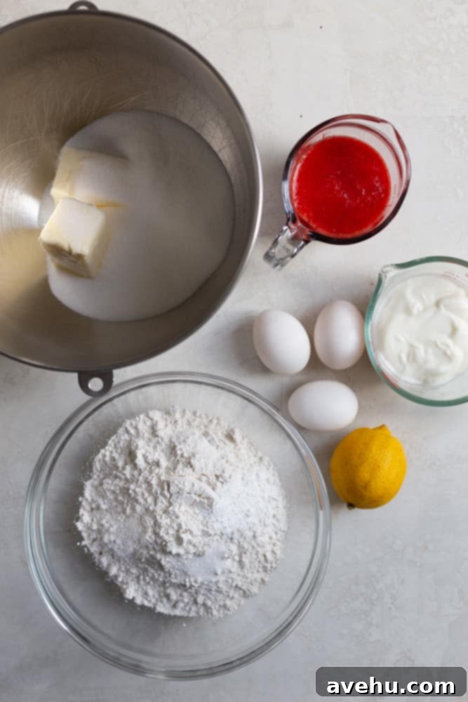 Luscious Strawberry Bundt Cake 3 A collection of fresh, high-quality ingredients for a strawberry bundt cake, artfully arranged on a subtle gray background, ready for baking.