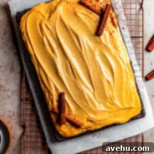 Decadent Chocolate Pumpkin Sheet Cake 9 Chocolate cake with pumpkin cream cheese frosting and decorated with cinnamon sticks
