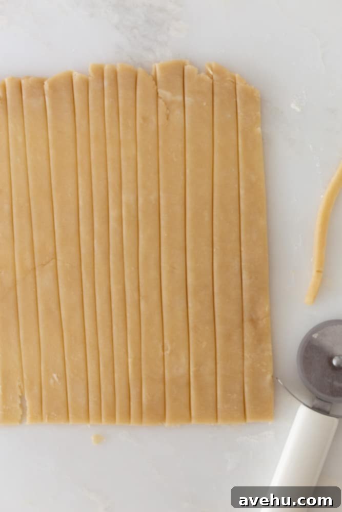 Sweet & Simple Caramel Apple Lattice Pie 8 Pie crust dough expertly cut into straight, even strips, prepared for weaving a lattice top.