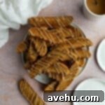Gingerbread Biscotti with a Frosty Crunch 16 A whole plate of gingerbread biscotti sitting on a pink surface