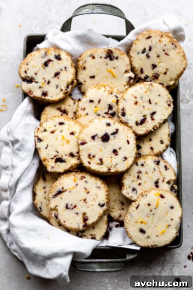 Cloudlike Cranberry Shortbread Delights 2 Beautifully arranged cranberry orange shortbread cookies on a festive platter, ready for holiday enjoyment and sharing.