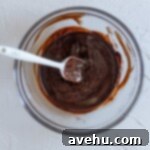 Melted butter and chocolate in a glass bowl.