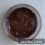 Brownie batter after whipping, showing increased volume and lightness.