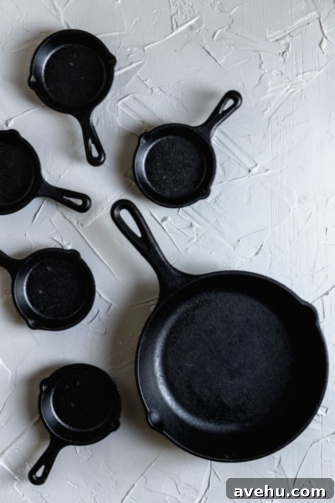 Ultimate Gooey Skillet Chocolate Chip Cookie 3 An 8" and 3" mini skillets on a gray surface, showcasing the different size options