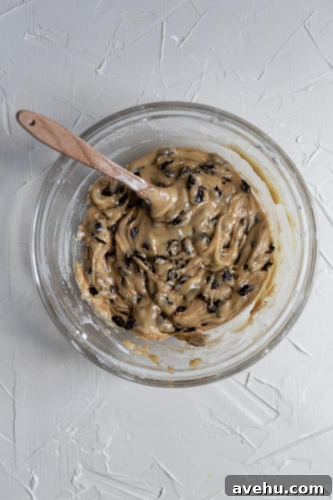 Ultimate Gooey Skillet Chocolate Chip Cookie 6 skillet cookie batter in a glass bowl, showing the consistency before adding to skillet