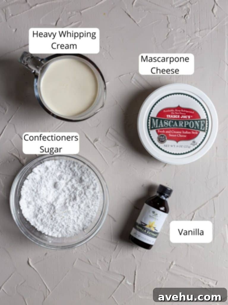 Indulgent Mascarpone Frosting: 10-Minute Perfection 3 A collection of ingredients for mascarpone frosting, including a block of mascarpone cheese, a carton of heavy whipping cream, a bowl of confectioners sugar, and a bottle of vanilla extract, neatly arranged on a clean surface.