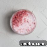 Decadent Strawberry Chewies 4 Freeze dried strawberries mixed with sugar in a small glass bowl