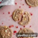 Decadent Strawberry Chewies 8 strawberry cookies broken apart on a pink surface