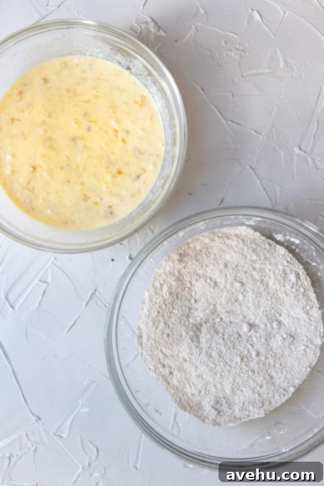 Simple and Scrumptious Banana Chocolate Chip Muffins 5 Separate bowls for wet and dry banana muffin ingredients, highlighting the organized preparation.