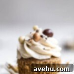 Irresistibly Fluffy Espresso Cupcakes 6 One espresso cupcake with it sliber pulled down on a gray surface