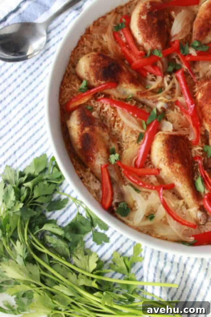 Simple and Savory Arroz Con Pollo 4 Delicious one-pan Arroz con Pollo cooked to perfection, showcasing golden-brown chicken and fluffy rice