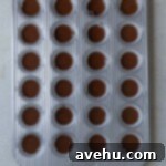 Mini cupcake batter in a mini cupcake tin